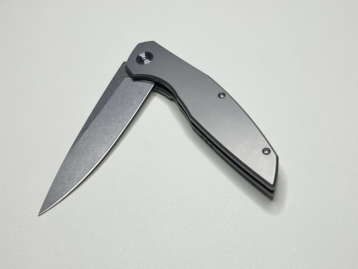 Titanium alloy folding knife, bearing assisted